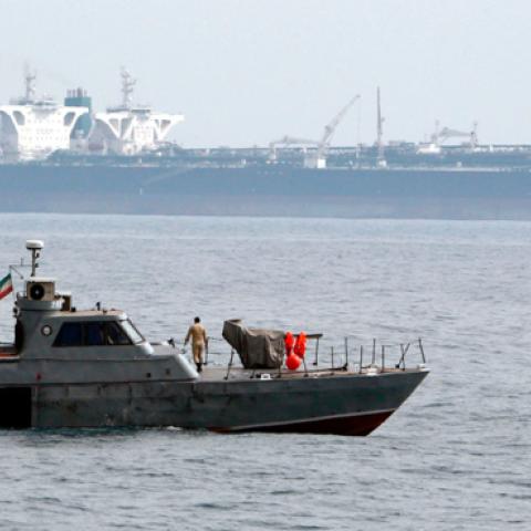 A picture taken on March 12, 2017, shows an Iranian military speedboat patrols the waters as a tanker perpares to dock at the oil facility in the Khark Island, on the shore of the Gulf. (AFP/Getty Images)