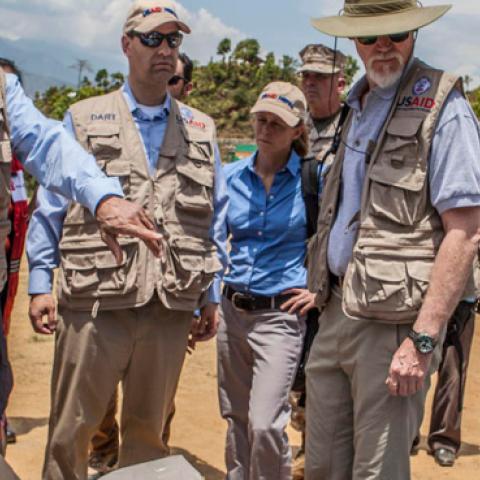 USAID staff are briefed during a visit to Nepal in the wake of a devastating 2015 earthquake. (USAID/Flickr)