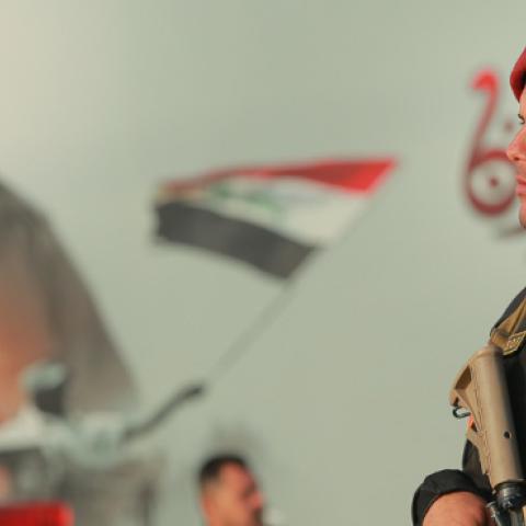 An armed member of the Iraqi Special Operations Forces secures a conference being held by the predominantly Shia Muslim Popular Mobilization Forces to honour Iranian fighters who died fighting the Islamic State. (Ameer Al Mohammedaw/Getty Images)