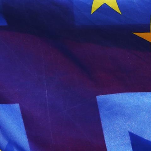 Flags of the European Union and Great Britain fly together on College Green near the Palace of Westminster. (Jonathan Brady/PA Images via Getty Images)