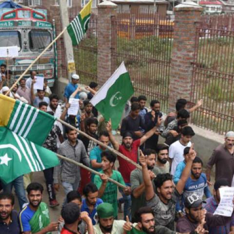 Kashmiri protesters hold Azad Kashmir and Pakistani National flag during a protest, on August 16, 2019 in Srinagar, India. (Hindustan Times via Getty Images)