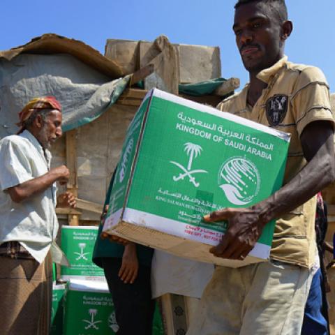 An internally displaced Yemeni men receive benefits from a Saudi Foundation on November 25, 2018 in Aden, Yemen. (UNOCHA via Getty Images)