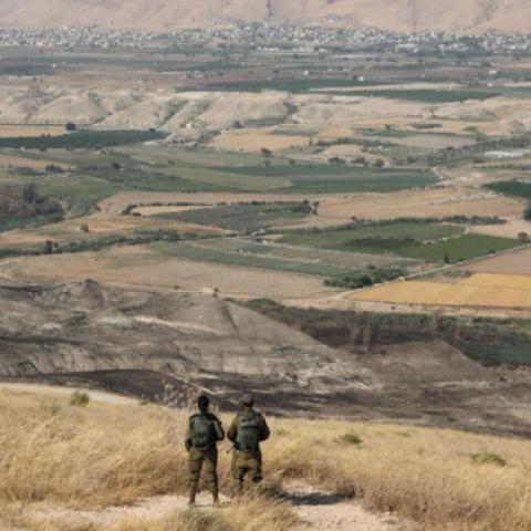 Israeli soldiers overlooking the Jordan Valley in June 2019. (Abir Sultan/Agence France-Presse/Getty Images)