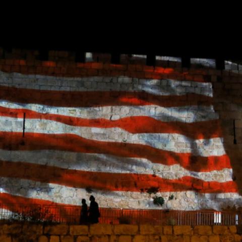 The Israeli and United States flags are projected on the walls of the ramparts of Jerusalem's Old City, to mark one year since the transfer of the US Embassy from Tel Aviv to Jerusalem on May 15, 2019. (AHMAD GHARABLI/Getty Images)