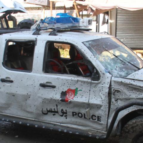 Afghan Security personnel inspect the scene of a suicide bomb blast targeted a Police vehicle on the outskirts of Jalalabad, Afghanistan, 13 June 2019. (Wali Sabawoon/NurPhoto via Getty Images)