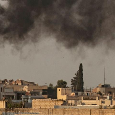 Smoke billows following Turkish bombardment on Syria’s northeastern town of Ras al-Ain in the Hasakeh province along the Turkish border on October 9, 2019.  (DELIL SOULEIMAN/AFP/Getty Images)
