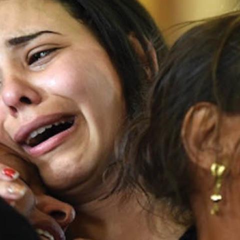 Women mourn for the victims of the blast at the Coptic Christian Saint Mark’s church east of Alexandria