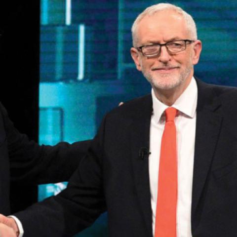 Prime Minister Boris Johnson and Leader of the Labour Party Jeremy Corbyn shake hands during the ITV Leaders Debate at Media Centre on November 19, 2019 in Salford, England. (ITV via Getty Images)