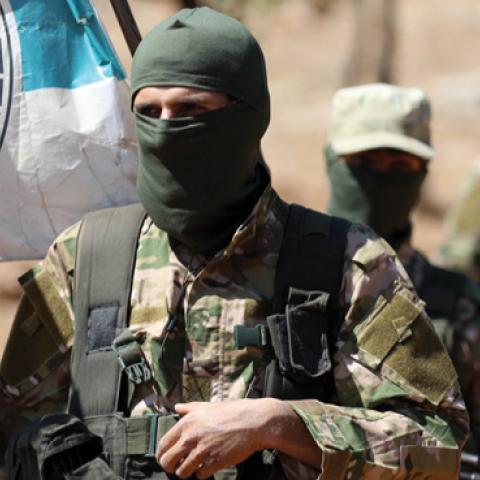Syrian fighters attend a mock battle in anticipation of an attack by the regime on Idlib province during a graduation of new HTS members at a camp in the countryside of the northern Idlib province August 14, 2018. (Getty Images)