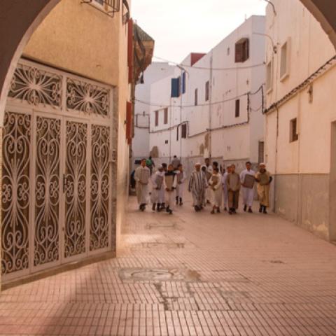 Students from an Islamic school walk near the Great Mosque of Sale near the capital of Rabat. (FADEL SENNA/AFP via Getty Images)