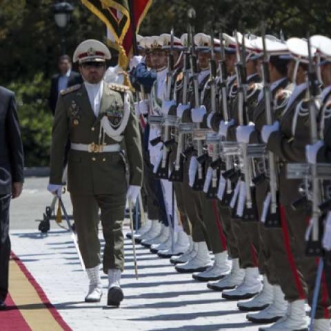 Turkish President Recep Tayyip Erdogan and Iran's President Hassan Rouhani review the honor guard during official welcoming ceremony at Saadabad Palace in Tehran, Iran on April 7, 2015. (Anadolu Agency/Getty Images)
