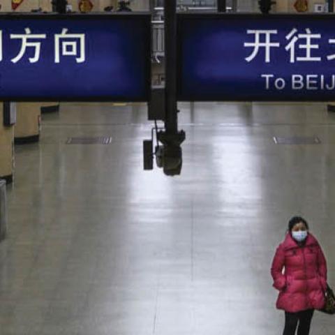 A Chinese woman wears a protective mask in Beijing, Feb. 3. 