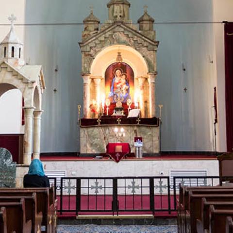 Iranian Armenian Christians pray in front of an altar in Saint Sarkis Cathedral in Tehran, Iran on September 27, 2018