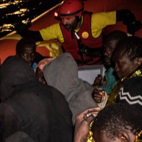 Refugees and migrants are transferred to the Spanish Proaciva Open Arms NGO rescue vessel Golfo Azzurro after being rescued by the Italian Coast Guard at 24 miles (46 km) north of Sabratha, Lybia on February 17, 2017 at Sea