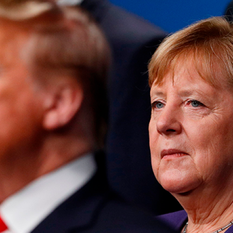 France's President Emmanuel Macron and German Chancellor Angela Merkel pose with NATO leaders including U.S. President Donald Trump for the family photo at the NATO summit in London on December 4, 2019. (PETER NICHOLLS/AFP via Getty Images)