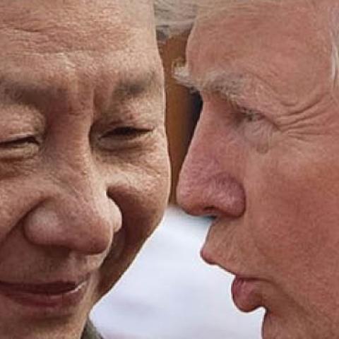 China's President Xi Jinping (L) and US President Donald Trump attend a welcome ceremony at the Great Hall of the People in Beijing on November 9, 2017