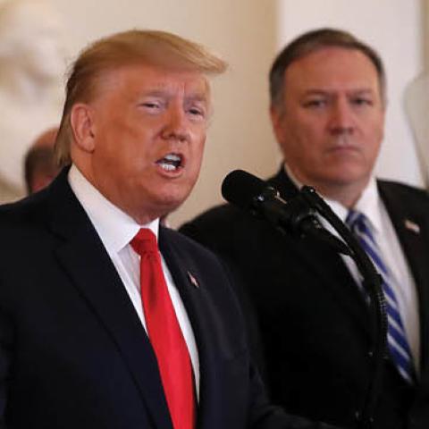 U.S. President Donald Trump speaks from the White House as Secretary of State Mike Pompeo listens on January 08, 2020 in Washington, DC