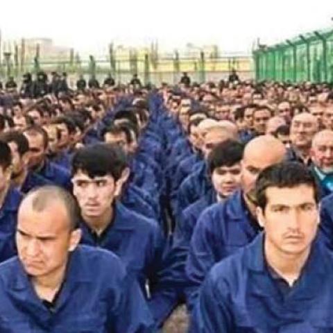 Uighur men in a reeducation camp in Xinjiang province
