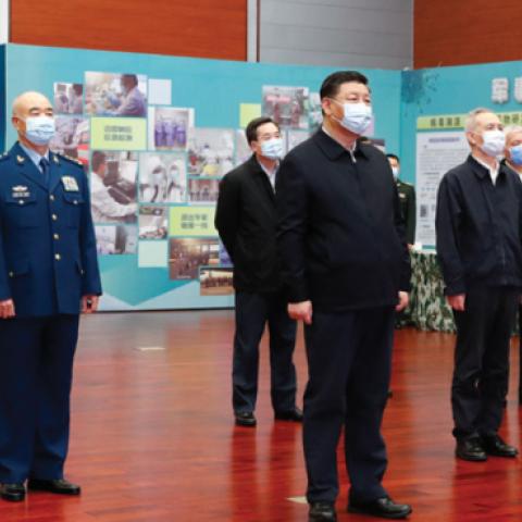 Chinese President Xi Jinping, also general secretary of the Communist Party of China Central Committee and chairman of the Central Military Commission, hears a report on the scientific research on COVID-19, March 2, 2020. (Getty Images)