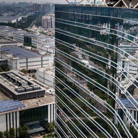 The Huawei logo is seen on the side of the main building at the company's production campus on April 25, 2019 in Dongguan, near Shenzhen, China.