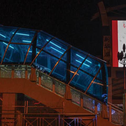A large monitor shows an image of Chinese president Xi Jinping wearing a mask in the nearly empty Beijing Station on March 13, 2020 in Beijing, China.