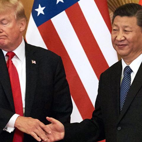 President Donald Trump and China's President Xi Jinping shake hands at a press conference following their meeting outside the Great Hall of the People in Beijing on November 9, 2017. (Artyom Ivanov\TASS via Getty Images)