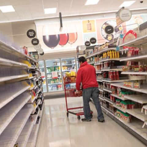 Empty shelves and shoppers are visible at a Target retail store during an outbreak of the COVID-19 coronavirus in Contra Costa County, Dublin, California, March 15, 2020. 