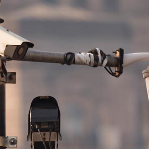 CCTV security camera against Shanghai bund historic building.