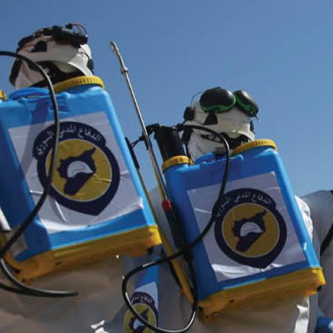 Members of the Syrian civil defence, also known as the White Helmets, prepare their sterilisation equipment before a sterilization campaign for hospitals in the city of Idlib against the Coronavirus (COVID-19) pandemic, after the emergence of suspected ca
