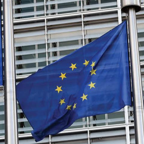 European Union flags hang outside the European Commission Headquarters on March 10, 2017 in Brussels, Belgium