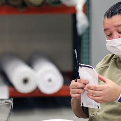 An inmate sews protective masks at Las Colinas Women's Detention Facility in Santee, California, on  April 22, 2020. 