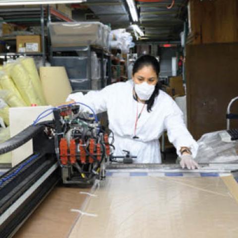 An employee inside Ferrara Manufacturing makes masks during the coronavirus pandemic on April 6, 2020 in New York City.