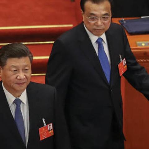 Chinese President Xi Jinping and Chinese Premier Li Keqiang walk into the Great Hall of the People at the beginning of the Second Plenary Session of the National People's Congress on May 25, 2020 in Beijing, China