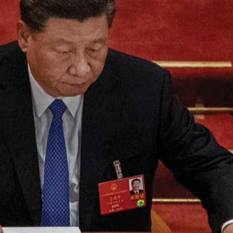 Chinese president Xi Jinping arranges his papers at the closing session of the National People's Congress, which included a vote on a new draft security bill for Hong Kong, at the Great Hall of the People on May 28, 2020 in Beijing, China. 