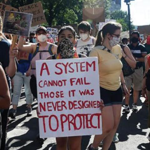 Demonstrators march at a peaceful protest against police brutality on Sunday in Washington, D.C.