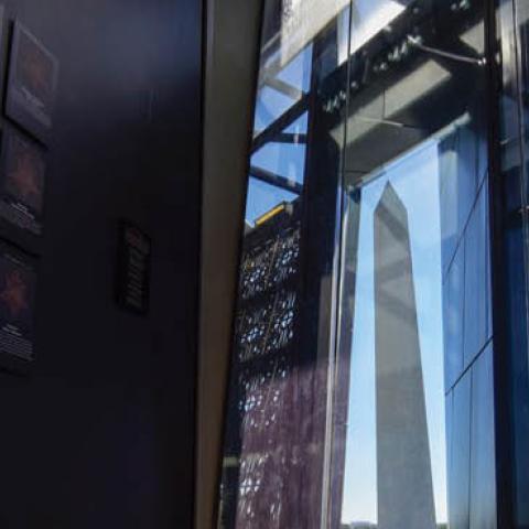 The Washington Monument as seen from inside the National Museum of African American History and Culture in Washington.
