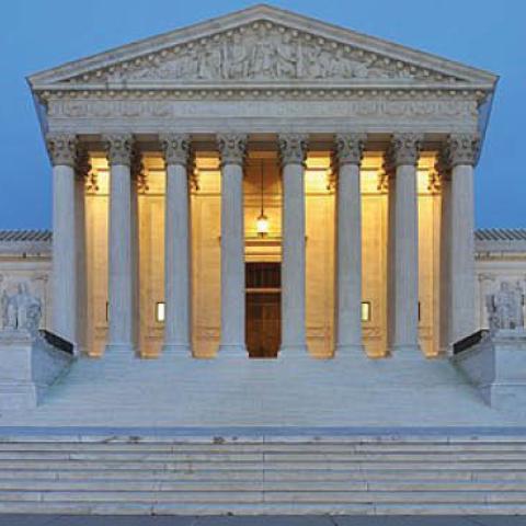 Panorama of the west facade of United States Supreme Court Building at dusk in Washington, D.C., USA.