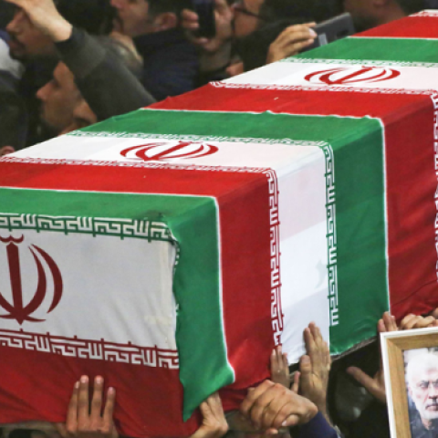 Mourners carry the coffins of slain Iraqi paramilitary chief Abu Mahdi al-Muhandis, Iranian military commander Qasem Soleimani and eight others during a funeral procession in Iraq on January 4, 2020. (Photo by MOHAMMED SAWAF/AFP via Getty Images)
