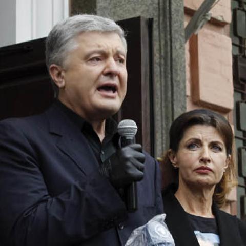 Former Ukrainian President Petro Poroshenko speaks to his supporters near a district court in Kiev, Ukraine, on June 18, 2020.