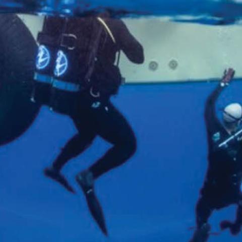 Seabee divers perform maintenance on undersea cables at the Pacific Missile Range Facility Barking Sands, Hawaii. Much of the globe's military and civilian electronic messages flow through undersea cables.