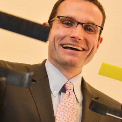Dr. Will Roper, Director of the Strategic Capabilities Office under the Office of the Secretary of Defense, explains U.S. military's use of the Micro UAV called Perdix at the Defense Advanced Research Projects Agency building on March 4, 2016, in Arlingto