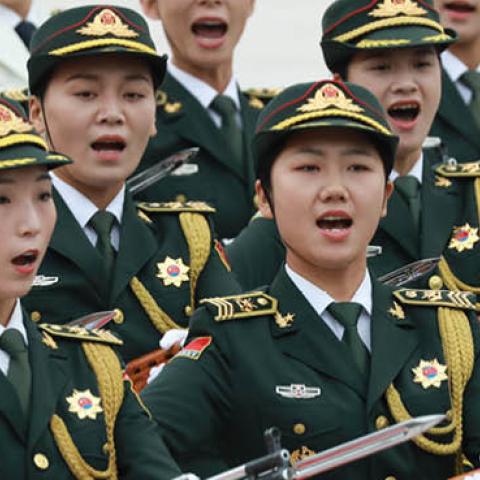  Female soldiers of the Guard of Honour of the People's Liberation Army shout as they walk in front of Chinese President Xi Jinping and Kazakh President Kassym Jomart Tokayev (not pictured) during the welcoming ceremony at the beginning of the meeting on 