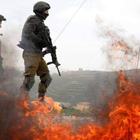 Israeli soldiers stand during clashes with Palestinians at a protest against Jewish settlements in the village of Oref in the Israeli-occupied West Bank, February 15, 2019. (Mohamad Torokman/Reuters)