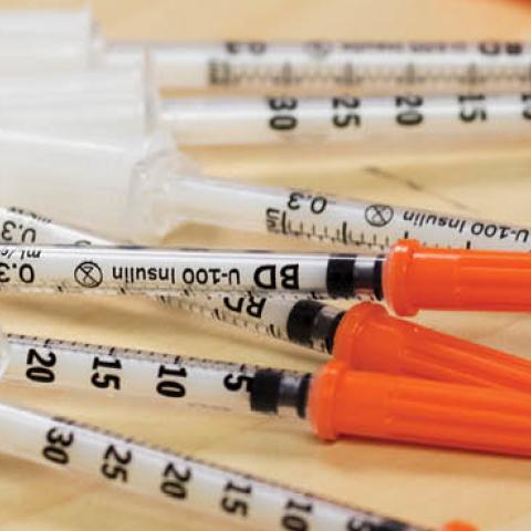 Needles for illegal drug injection on display during a news conference announcing three safe injection sites for the city in Toronto, Ontario.