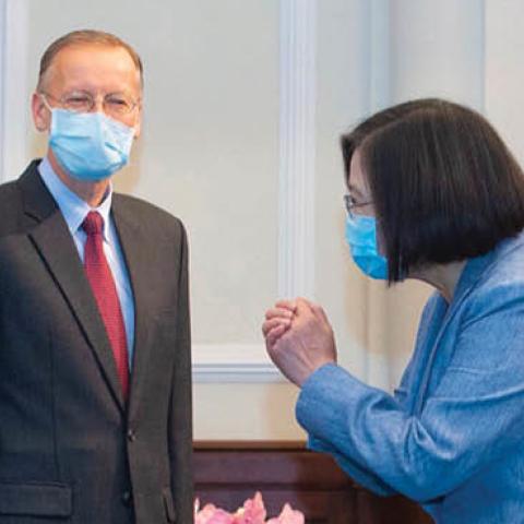 Taiwan's President Tsai Ing-wen gestures to a US official as US Secretary of Health and Human Services Alex Azar and director of the American of Institute in Taiwan, Brent Christensen, look on during their visit to the Presidential Office in Taipei 