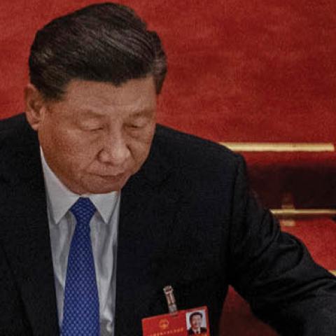 Chinese president Xi Jinping arranges his papers at the closing session of the National People's Congress