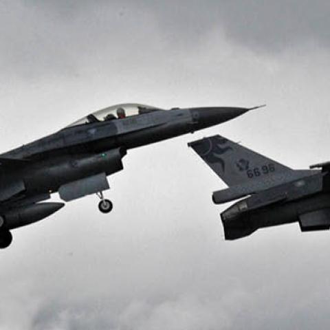 Two US-made F-16 fighters in the air during an scramble take off at the eastern Hualien air force base on January 23, 2013. The Taiwan air force demonstrated their combat skills at the Hualien air base during an annual training before the coming lunar new