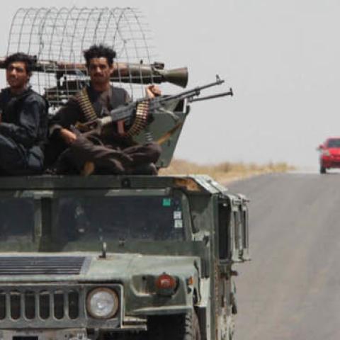 Afghan security officials patrolled a highway in the southern province of Helmand in August. The province is a Taliban stronghold.