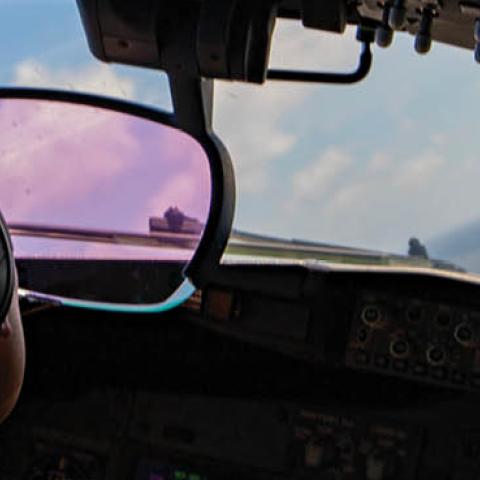 A pilot with the “Grey Knights” of VP-46 flies a P8-A Poseidon during intelligence surveillance reconnaissance drills on July 17, 2020. 
