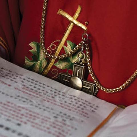 A Chinese Catholic deacon holds a bible at the Palm Sunday Mass during the Easter Holy Week at an "underground" or "unofficial" church on April 9, 2017 near Shijiazhuang, Hebei Province, China. 
